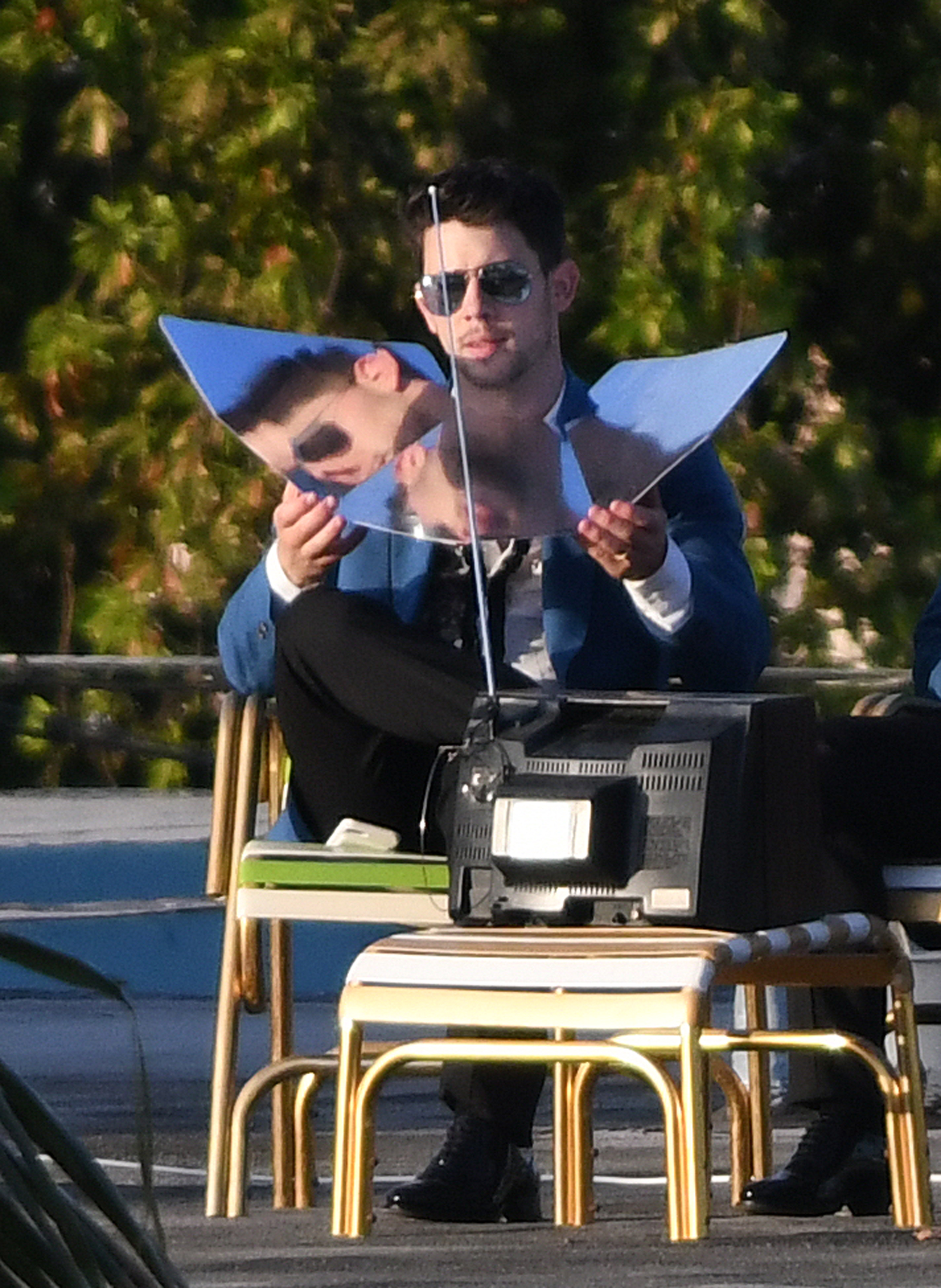 Nick Jonas sun tanning