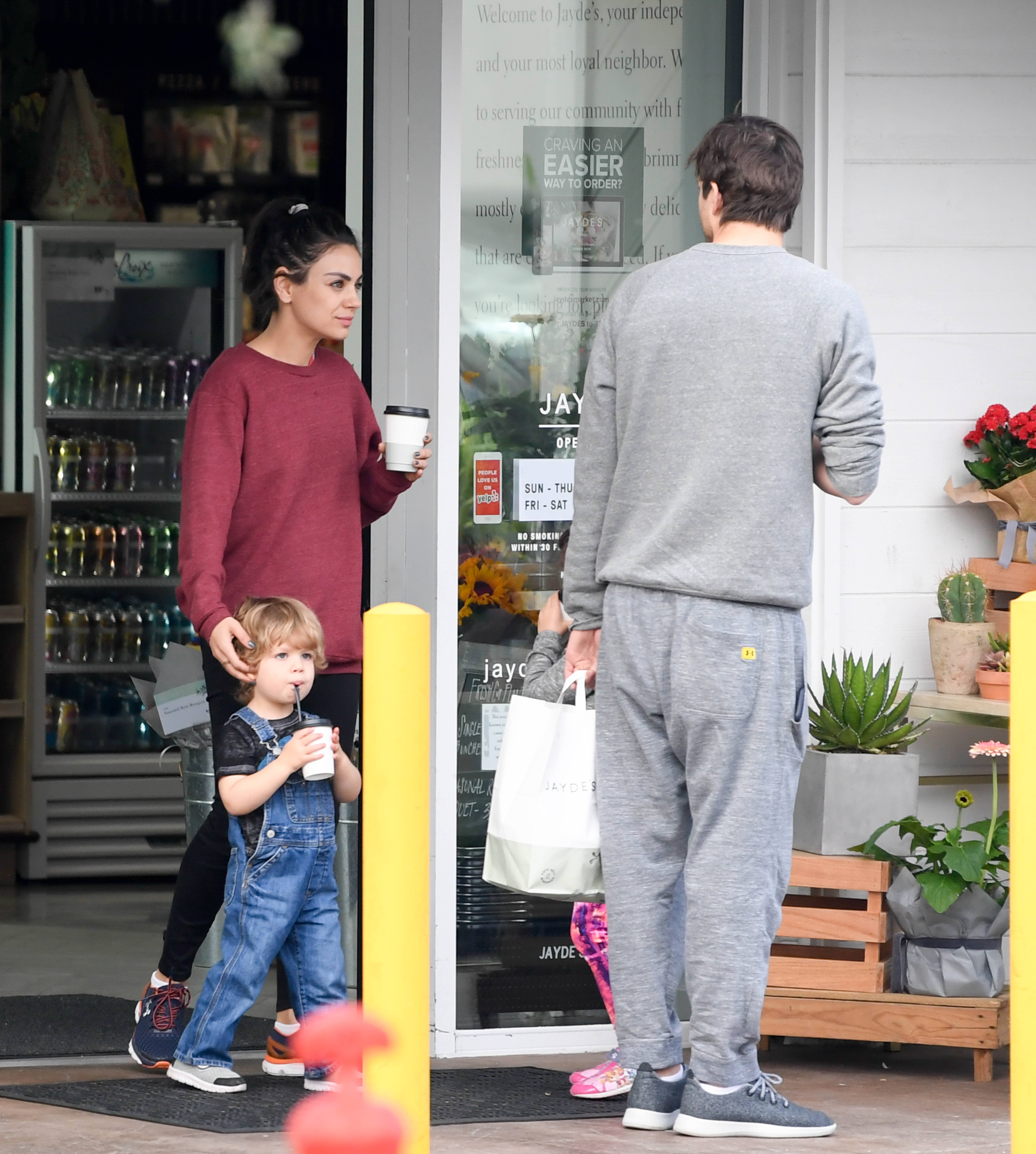 Mila Kunis and Ashton Kutcher spotted grabbing coffee with their two children.