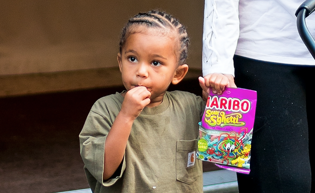 Kim Kardashian's son Saint West eating candy while walking in NYC.