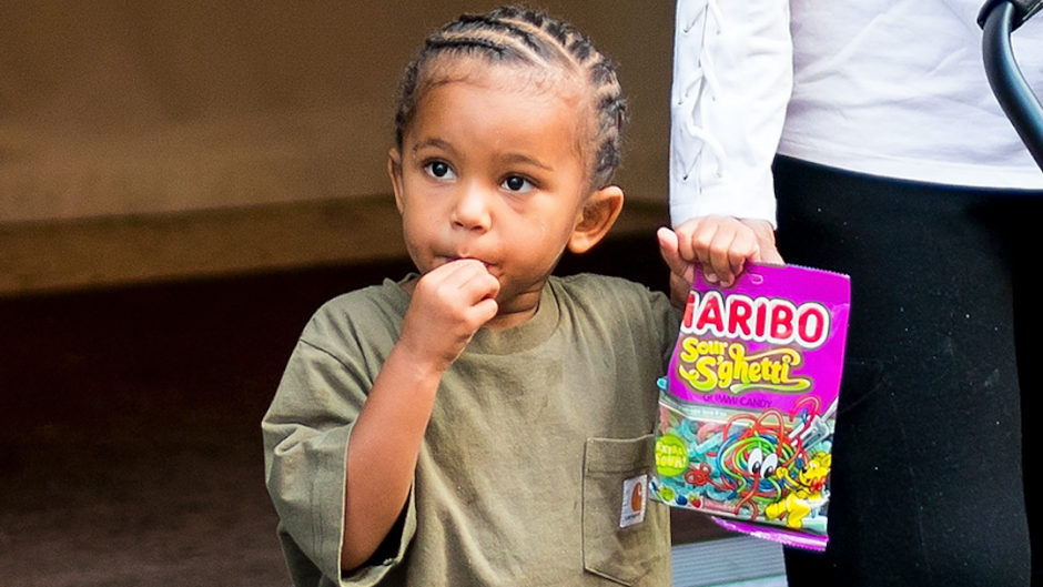 Kim Kardashian's son Saint West eating candy while walking in NYC.