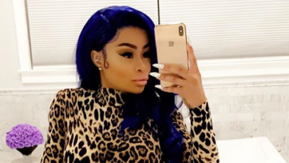 Blac Chyna selfie on Instagram with blue hair and cheetah print jumpsuit