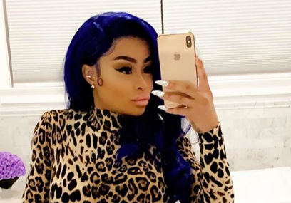 Blac Chyna selfie on Instagram with blue hair and cheetah print jumpsuit