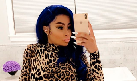 Blac Chyna selfie on Instagram with blue hair and cheetah print jumpsuit