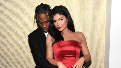 Travis Scott grammys Kylie Jenner red satin strapless dress PDA hugging