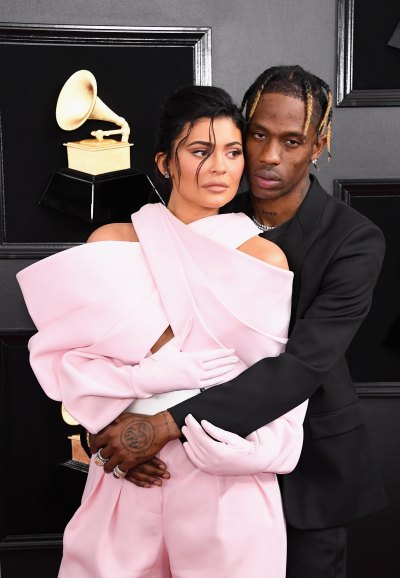 Kylie Jenner pink outfit Travis Scott black suit PDA at grammys