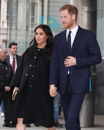 Prince Harry blue suit and Meghan Markle black dress baby bump Duke And Duchess Of Sussex 