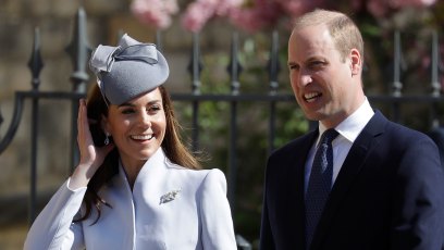 Kate Middleton wearing a blue outfit with Prince William