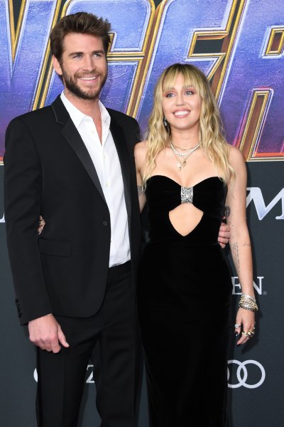 Miley Cyrus Liam Hemsworth avengers endgame red carpet black dress black suit