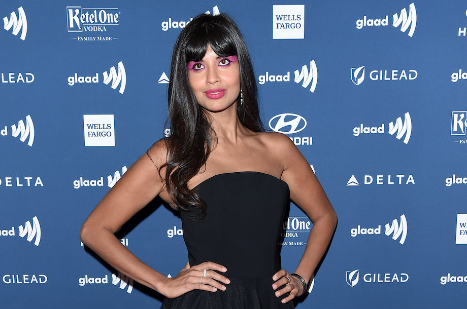 Jameela Jamil in a black dress.