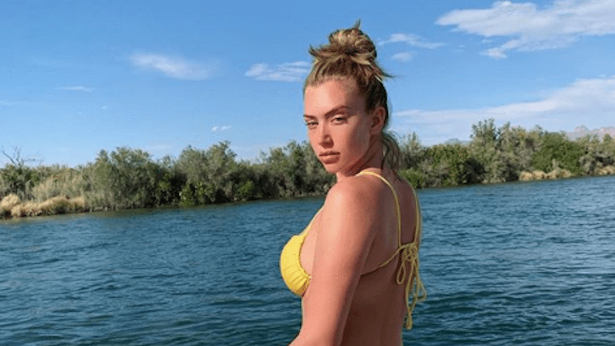 Anastasia Karanikolauo wearing a yellow bathing suit