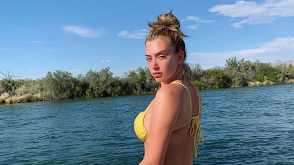 Anastasia Karanikolauo wearing a yellow bathing suit