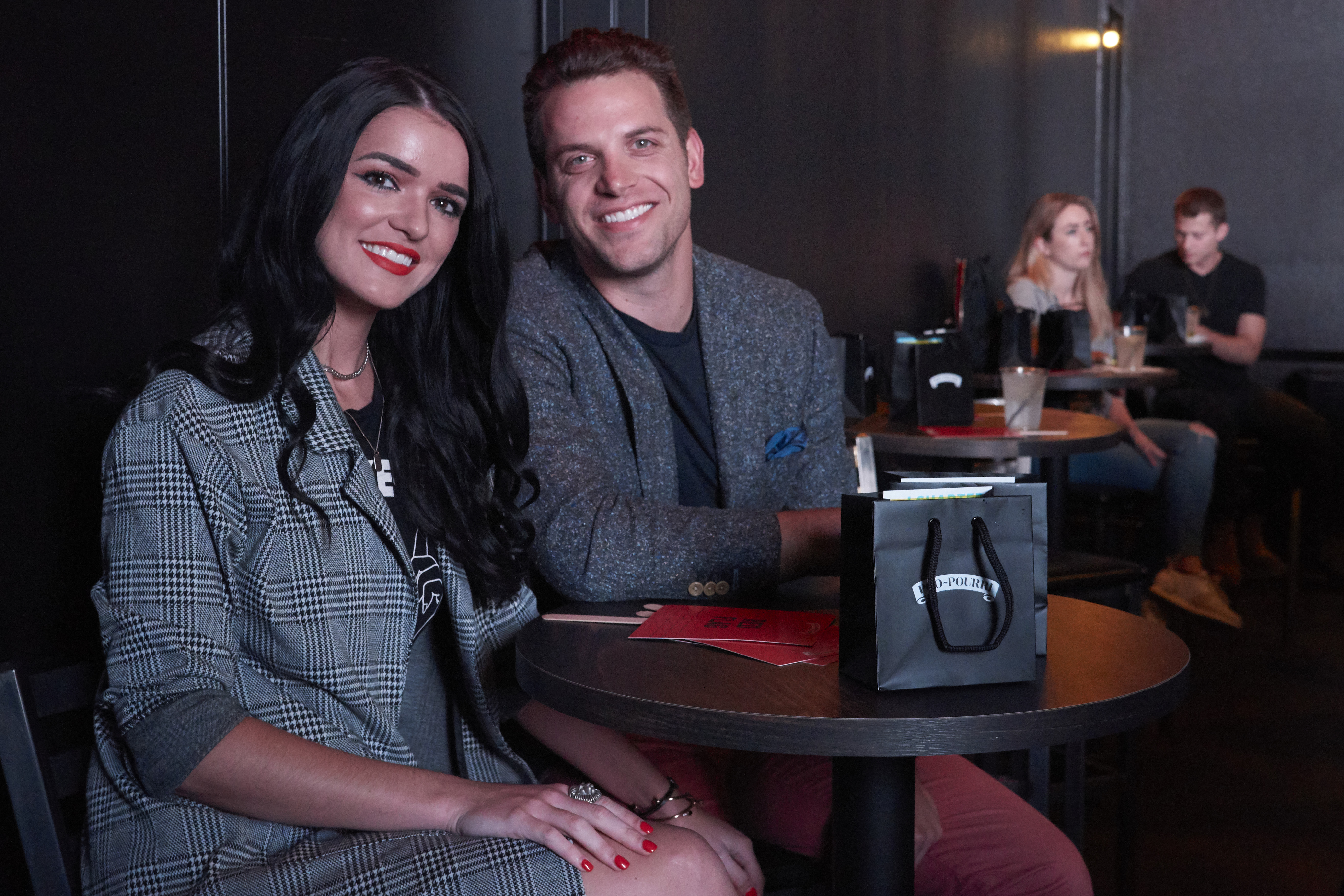 Bachelor Raven Gates and Adam Gottschalk date night happy smiling matching suits