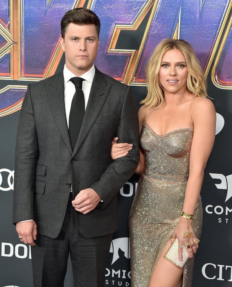 Colin Jost suit and Scarlett Johansson gold strapless dress engagement relationship avengers premiere