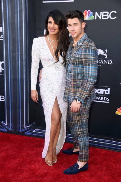 Priyanka Chopra white v neck gown Nick Jonas plaid suit 2019 Billboard Music Awards red carpet