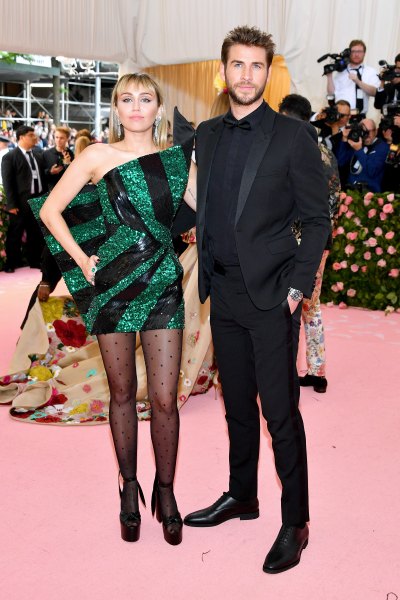 Miley Cyrus Liam Hemsworth 2019 met gala red carpet green and black dress black suit