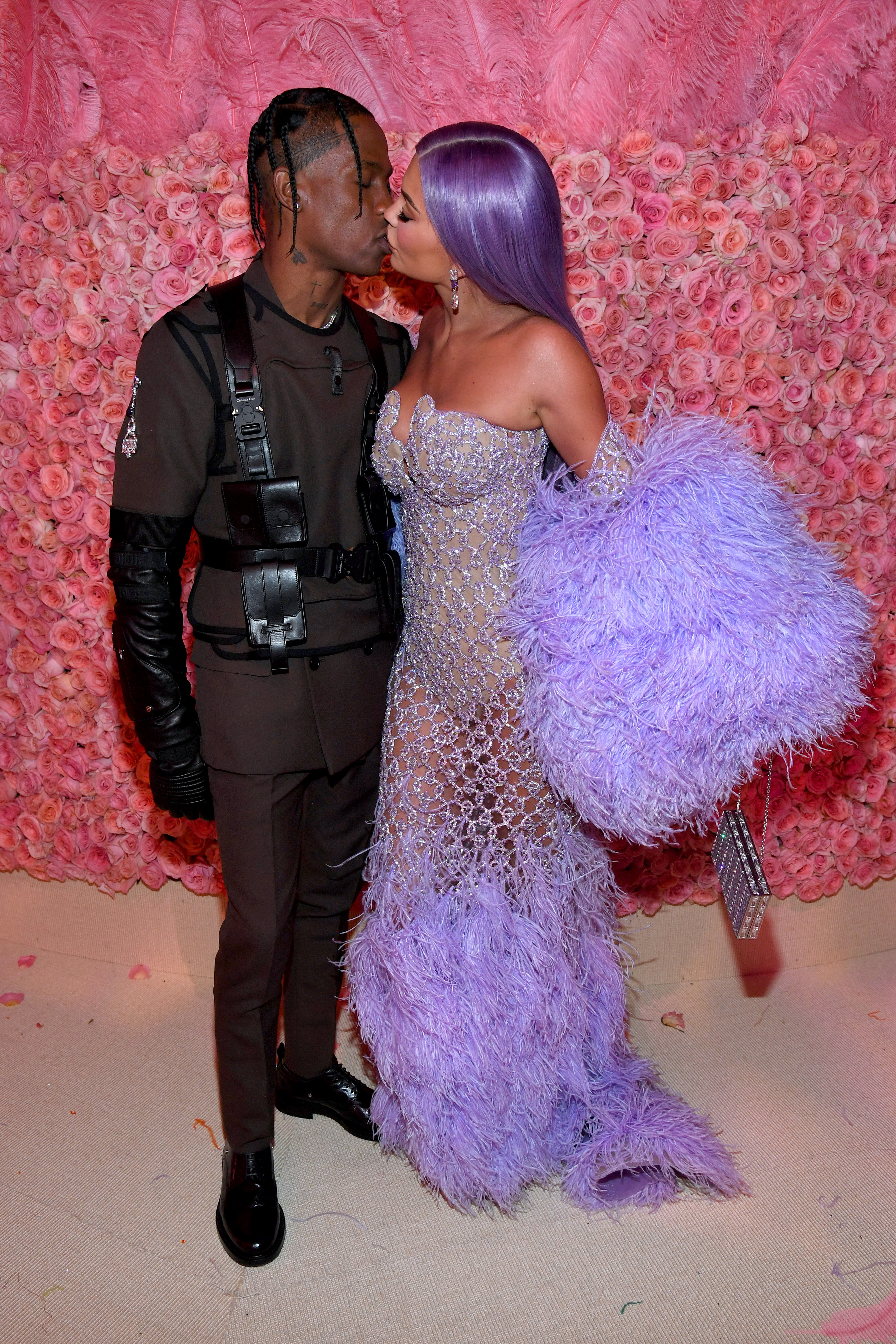 Travis Scott Kylie Jenner 2019 met gala kiss pda purple dress army suit