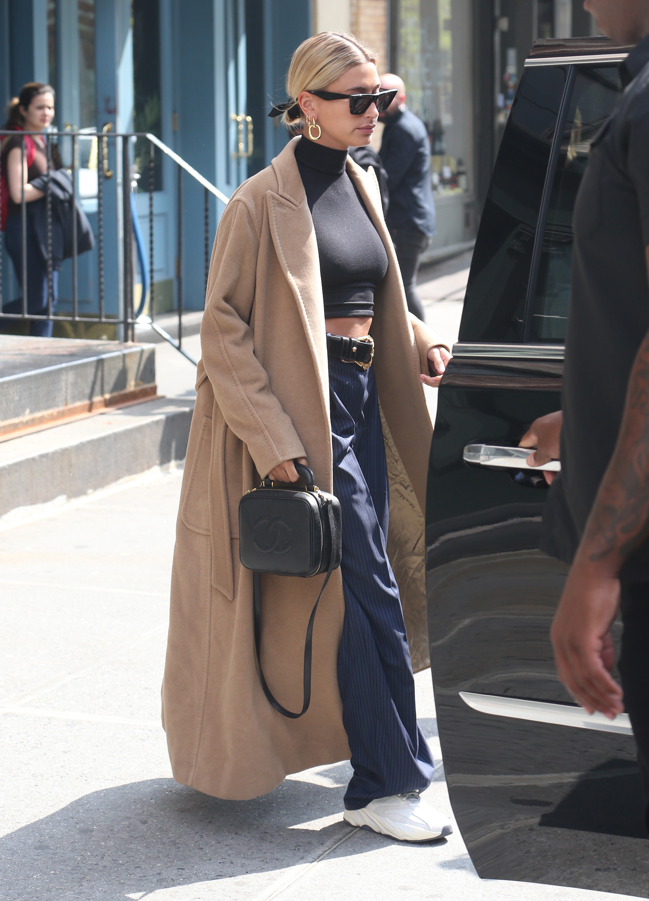 Hailey Baldwin long tan trench coat high waisted pants