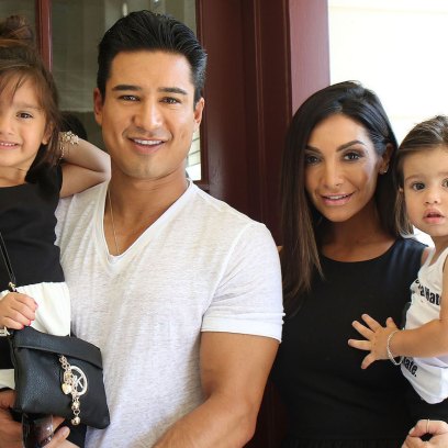 Mario Lopez Wearing a White T-Shirt with His Kids and Wife