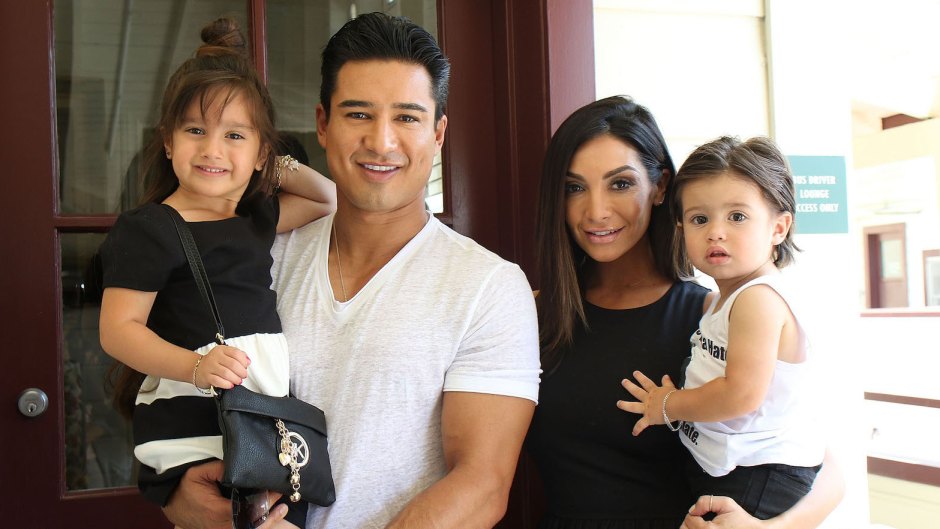 Mario Lopez Wearing a White T-Shirt with His Kids and Wife