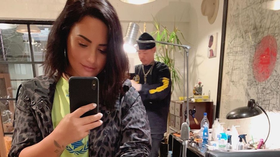 Demi Lovato dr. woo grandma tattoo forearm mirror selfie short hair