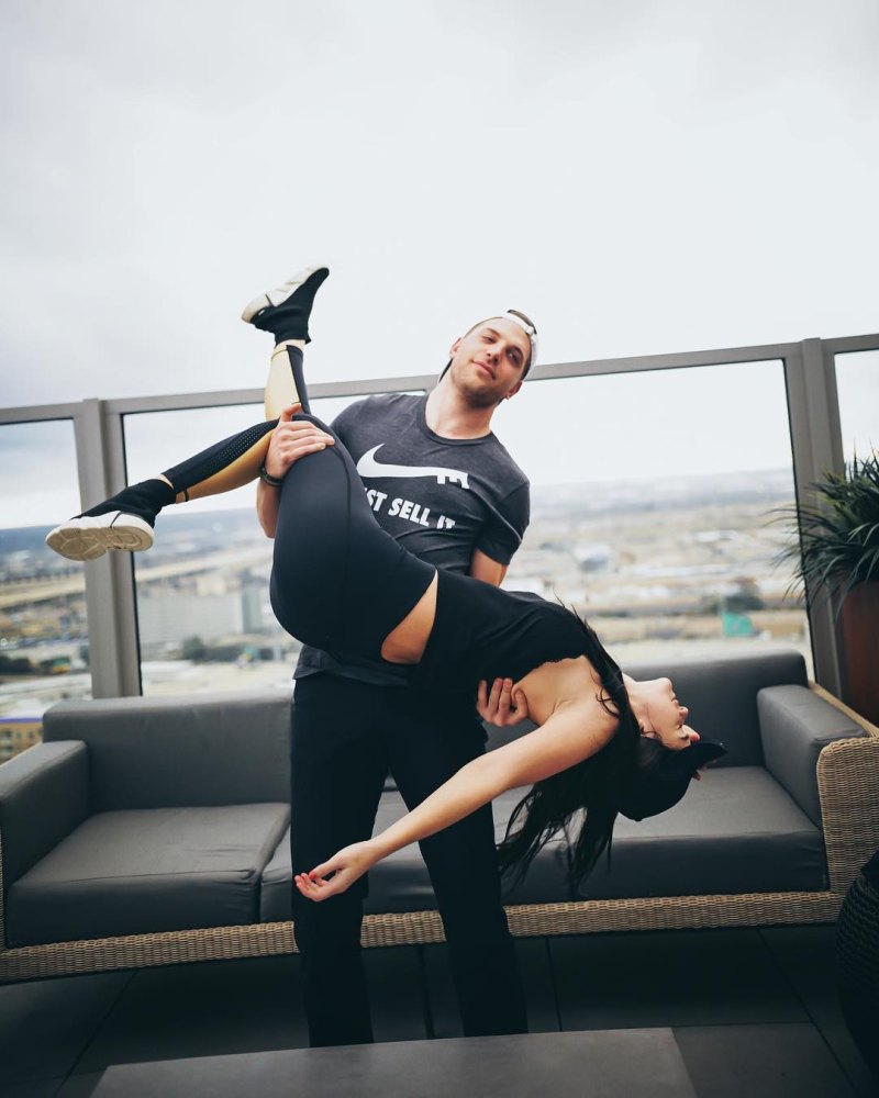 Bachelor Raven Gates and Adam Gottschalk workout clothes lifted in the air
