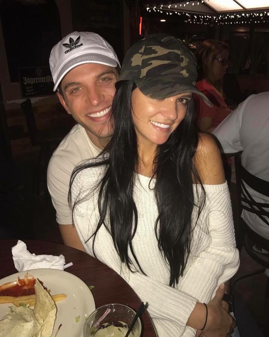 Bachelor Raven Gates and Adam Gottschalk camo hat sweater cuddled up
