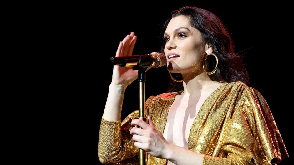 Jessie J body positivity fans editing photos singing on stage gold dress hoop earrings