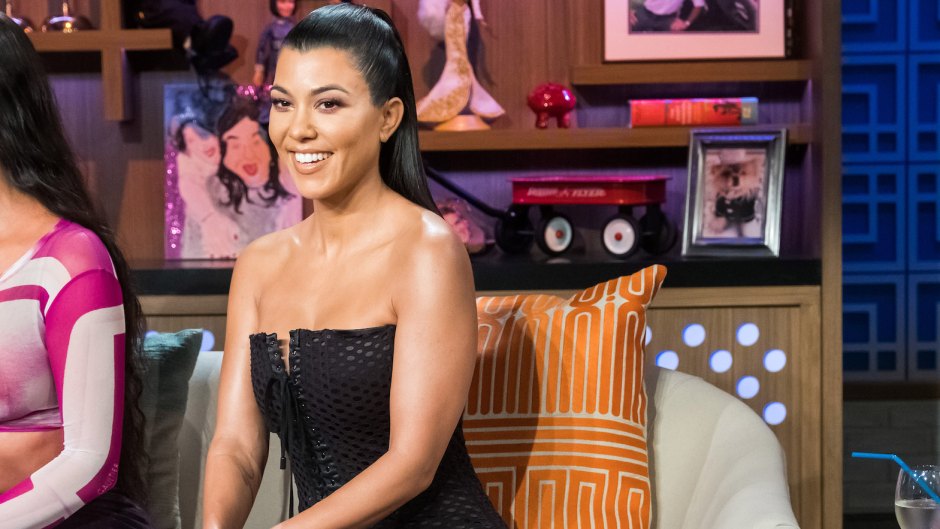 Kourtney Kardashian Smiles During Watch What Happens Live Wearing a Strapless Black Dress and Her Hair Half Up