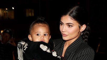 Kylie Jenner in Slicked Down Braid and Pinstripe Dress and Stormi Webster Walk Together