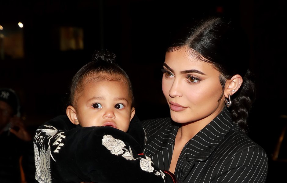 Kylie Jenner in Slicked Down Braid and Pinstripe Dress and Stormi Webster Walk Together