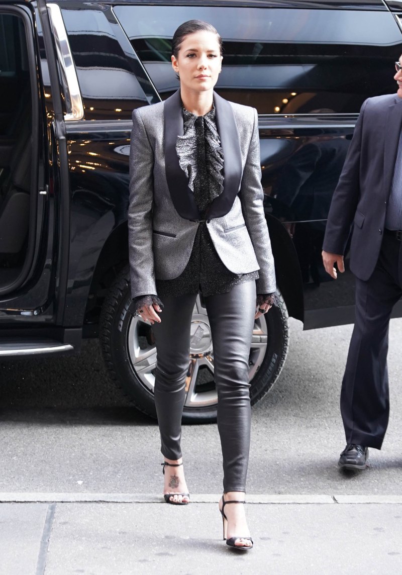 Halsey in a Sparkly Silver Tux Jacket With a Black Blouse and Black Leather Leggings and Short Slicked Back Black Hair