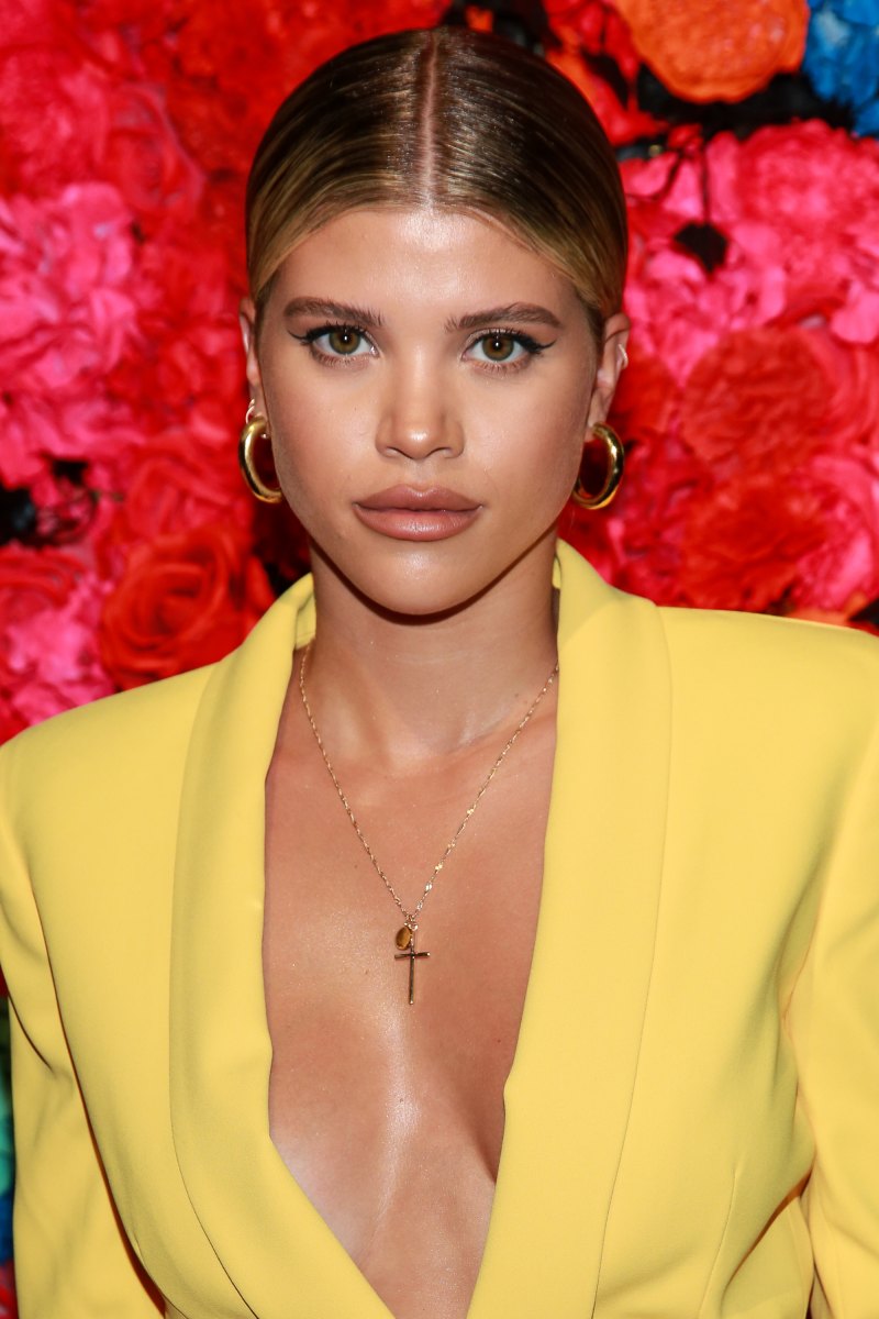 Close Up Photo of Sofia Richie Wearing a Yellow Suit Jacket and a Gold Cross Necklace