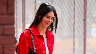 Kendall Jenner red monochromatic denim jacket and pants sunglasses smiling