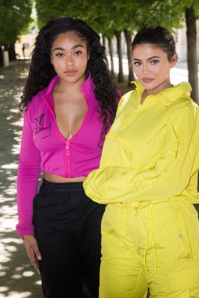 Jordyn Woods Pink Jacket Black Pants and Kylie Jenner Lime Green Jumpsuit