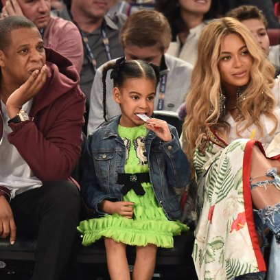 Jay-Z, Blue Ivy, and Beyonce Sitting Courtside