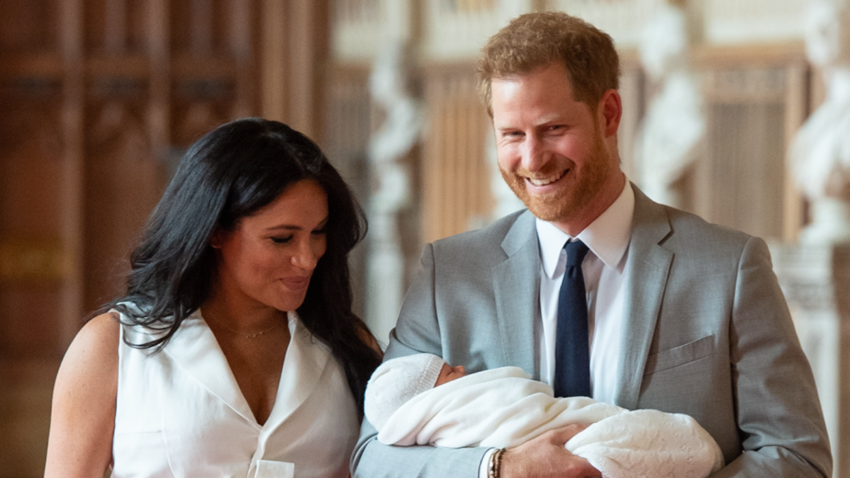 Britain's Prince Harry, Duke of Sussex (R), and his wife Meghan, Duchess of Sussex, pose for a photo with their newborn baby son, Archie Harrison Mountbatten-Windsor, in St George's Hall at Windsor Castle in Windsor, west of London on May 8, 2019.