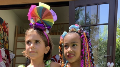 North West and Penelope Disick Dressed Up in Neon Candy Clothes