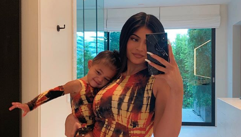 Kylie Jenner taking a mirror selfie with daughter Stormi Webster