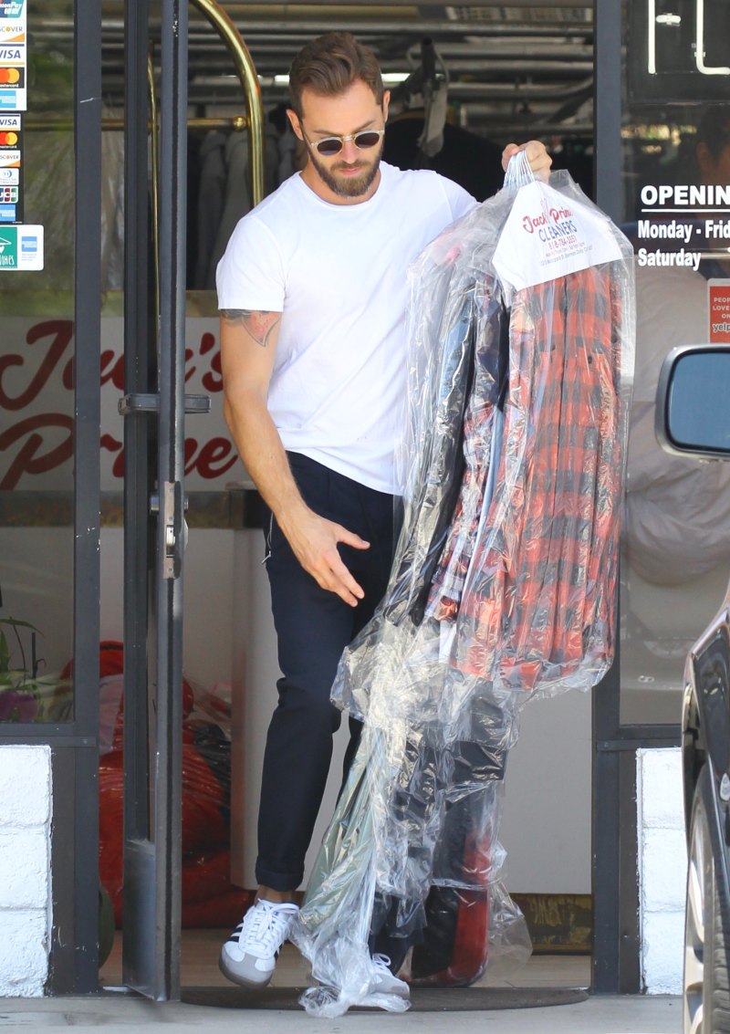 Nikki Bella in Green Track Pants and White Crop Top Running Errands With Artem Chigvintsev in Jeans and White Tshirt