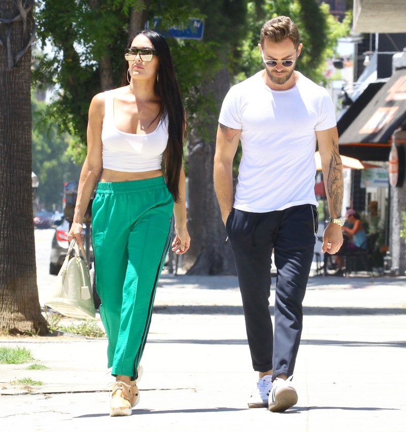 Nikki Bella in Green Track Pants and White Crop Top Running Errands With Artem Chigvintsev in Jeans and White Tshirt