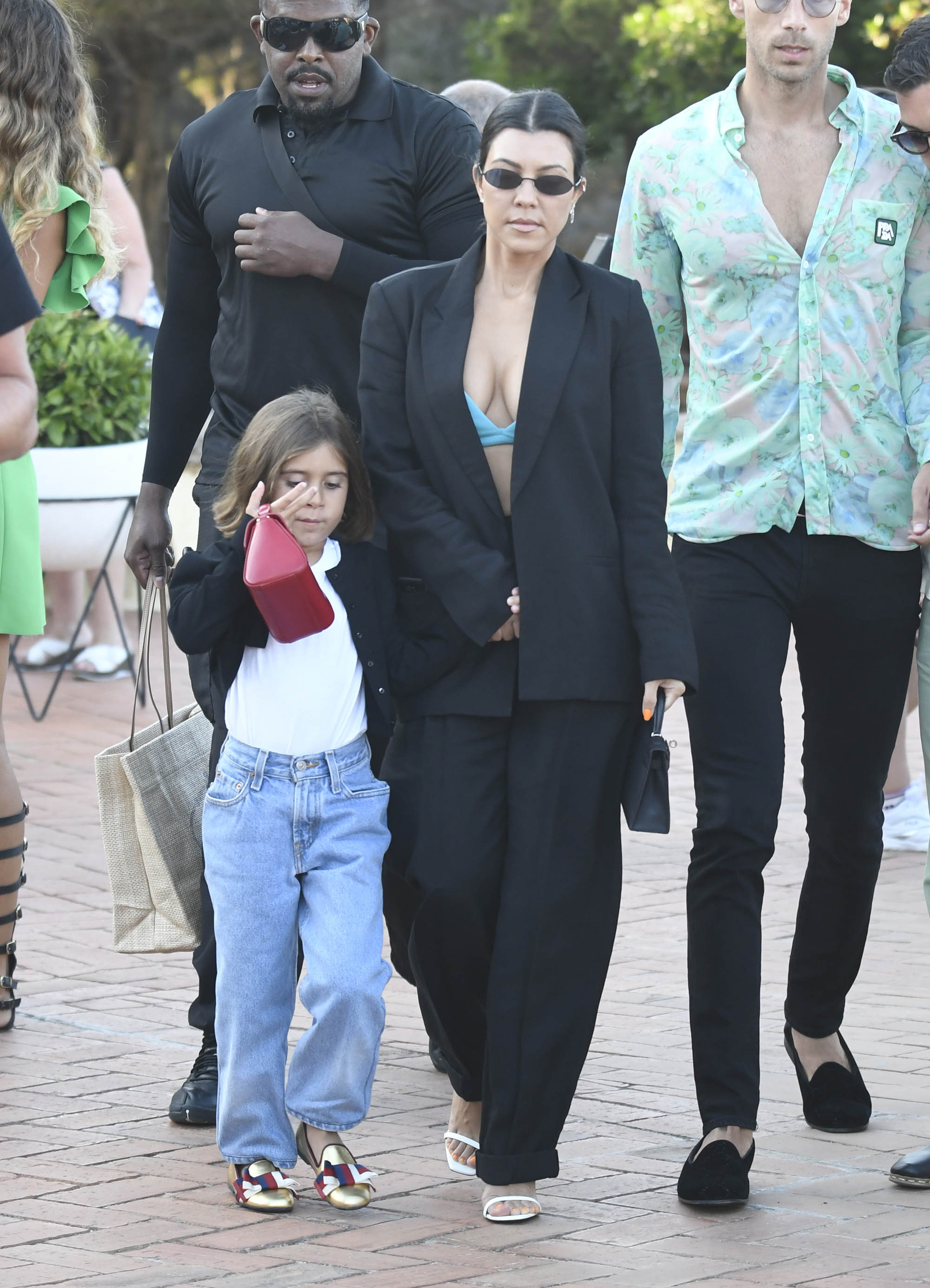 Kourtney Kardashian Out With Penelope Disick in Italy Wearing Green Bra and Black Suit