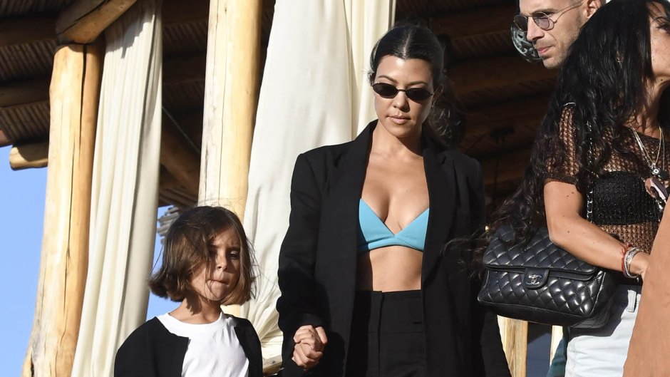Kourtney Kardashian Out With Penelope Disick in Italy Wearing Green Bra and Black Suit