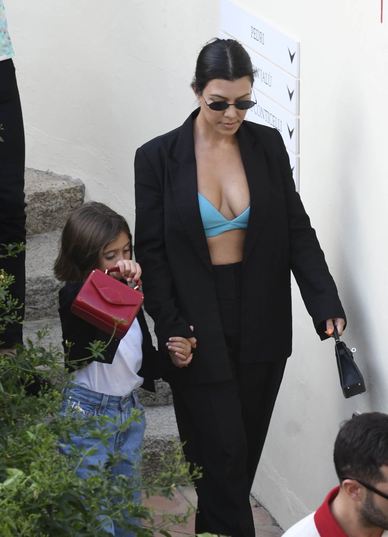Kourtney Kardashian Out With Penelope Disick in Italy Wearing Green Bra and Black Suit