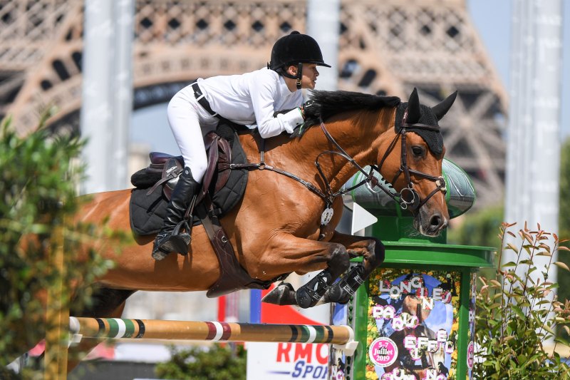Mary Kate Olsen riding Naomi competes in the Paris Eiffel Jumping