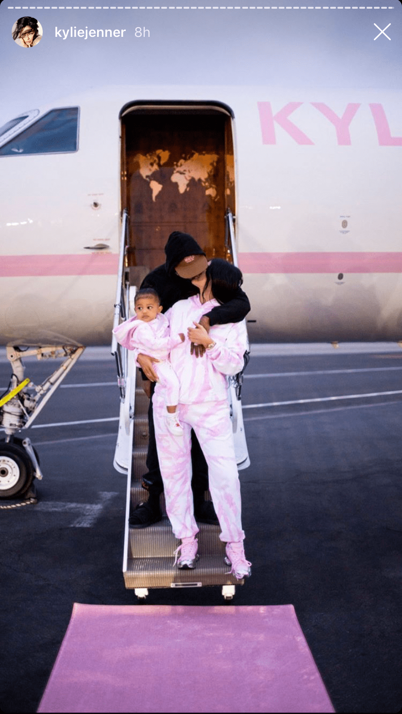 Kylie Jenner Kissing Travis Scott and Holding Stormi Webster