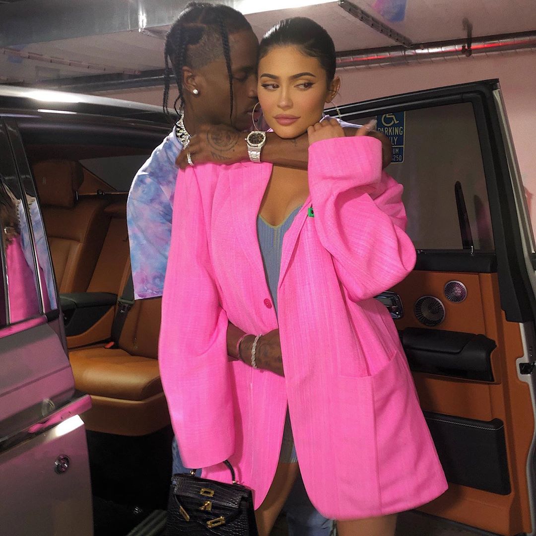 Kylie Jenner Wears Big Hot Pink Blazer While Travis Scott Hugs Her in Blue Tshirt