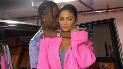 Kylie Jenner Wears Big Hot Pink Blazer While Travis Scott Hugs Her in Blue Tshirt