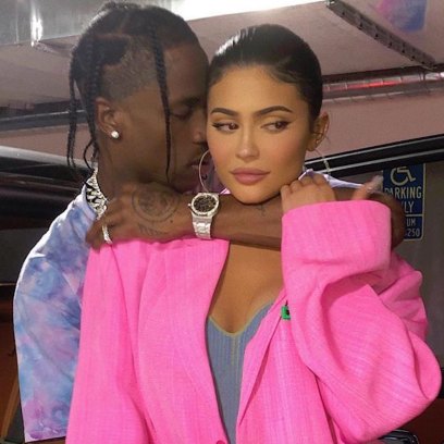 Kylie Jenner Wears Big Hot Pink Blazer While Travis Scott Hugs Her in Blue Tshirt