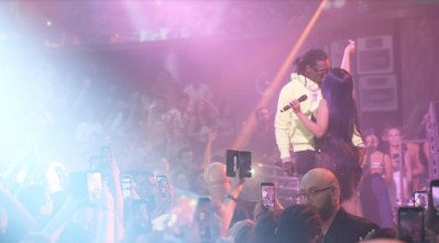 Cardi B kissing her husband, Offset, onstage