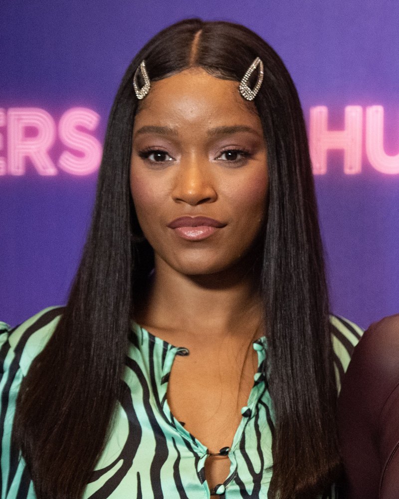 Keke Palmer posing with 2 clips in her hair